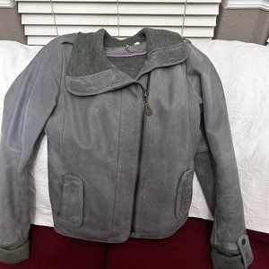 DOMA lambskin Leather gray assymetrical zip jacket with wool lining througout.